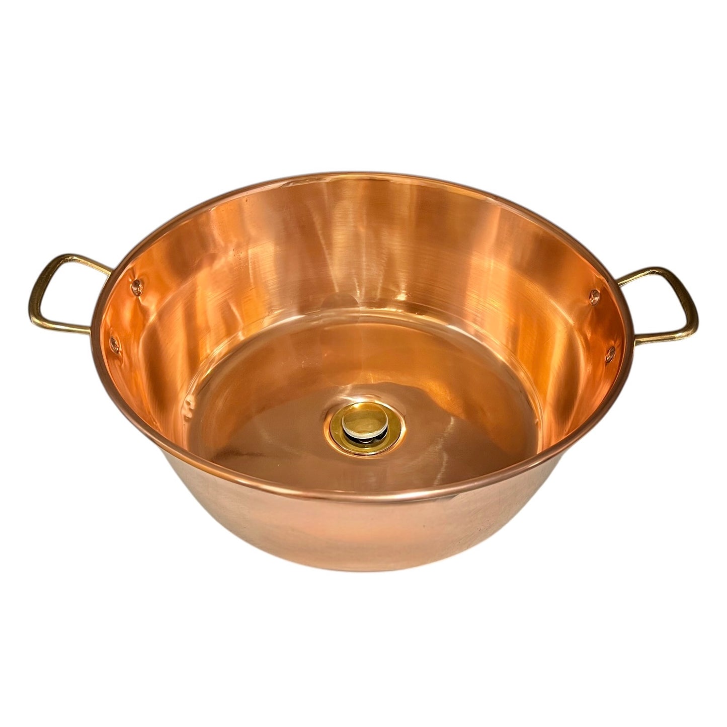 Copper sink bowl with brass handles and brass pop up waste on a white background