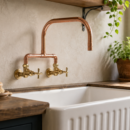White farmhouse sink with copper faucet in a kitchen setting