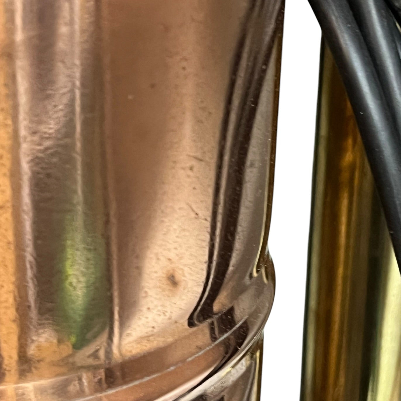 Close-up of a copper lamp with reflective surface