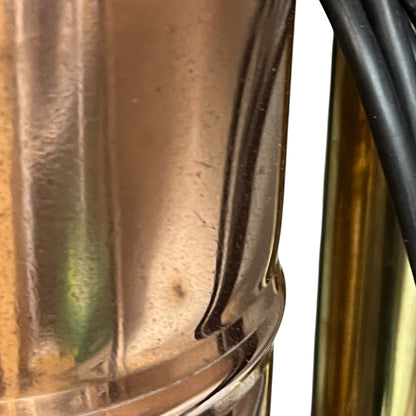 Close-up of a copper lamp with reflective surface