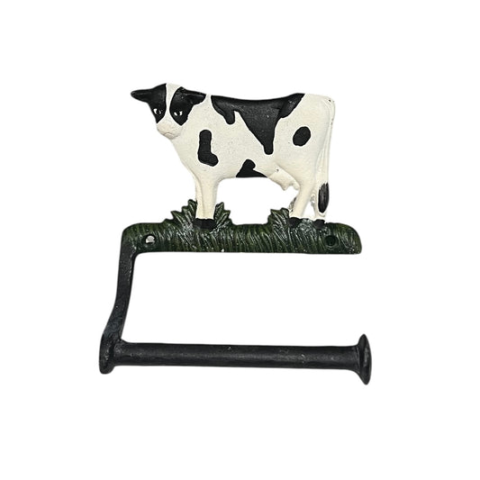 Decorative toilet paper holder with a cow design on a white background