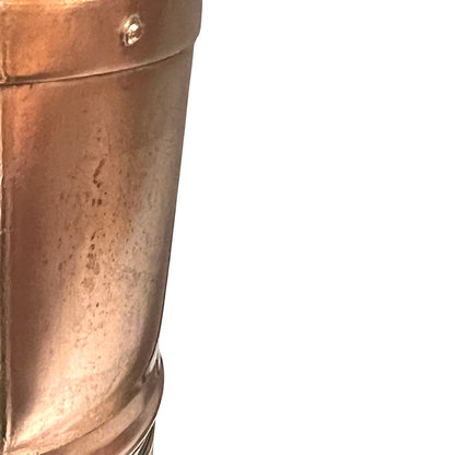 Close-up of a copper lamp with a white background