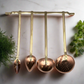Set of 4 French copper and brass utensils on a hanging bar