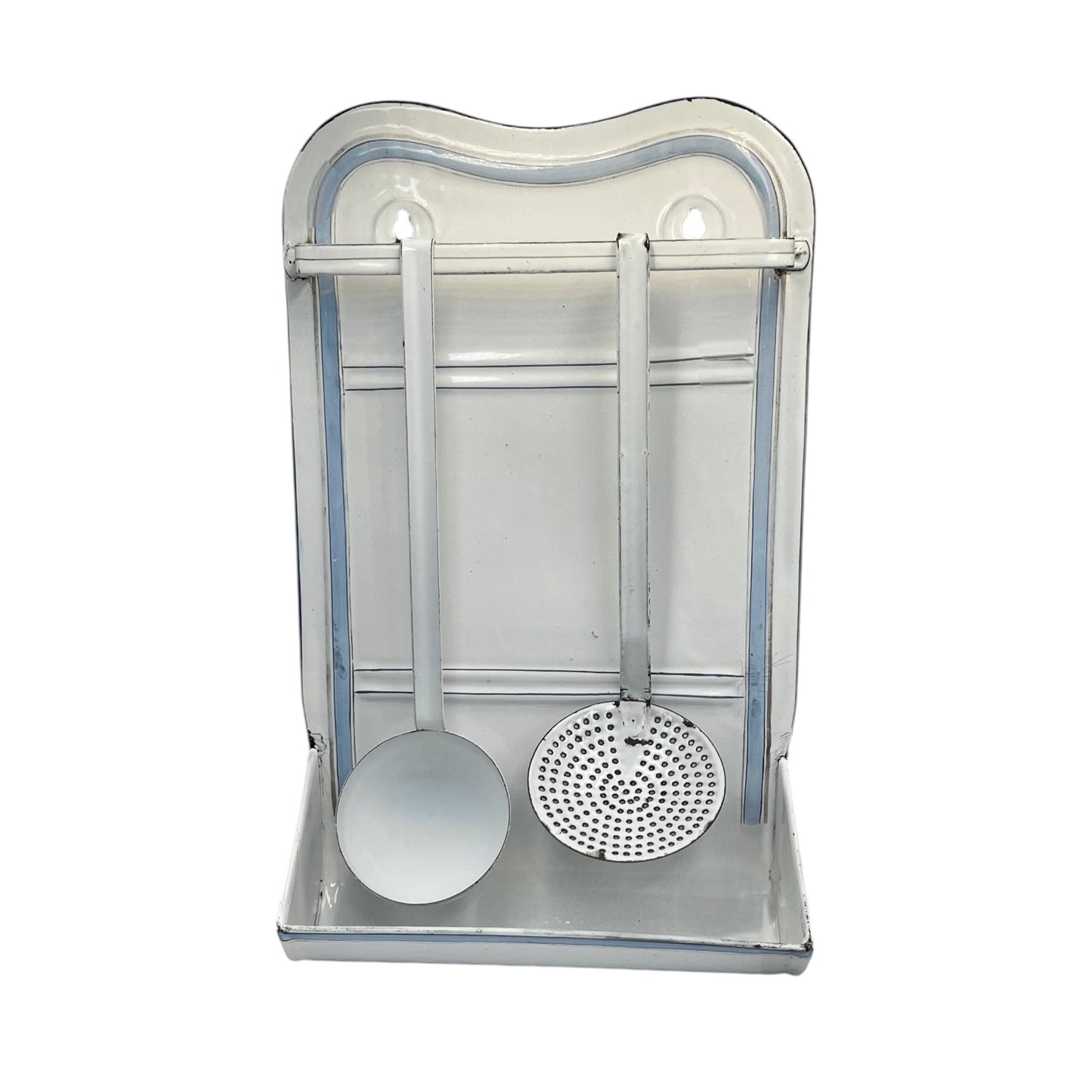 A vintage-style metal kitchen utensil rack with a ladle and a strainer hanging inside a rectangular metal holder on a white background.
