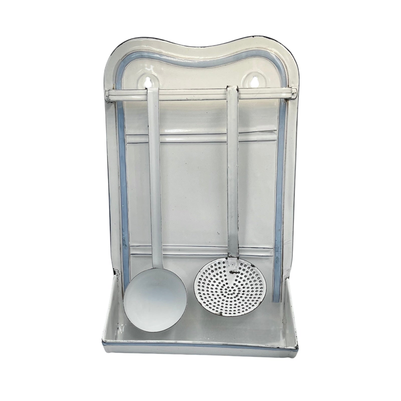 A vintage-style metal kitchen utensil rack with a ladle and a strainer hanging inside a rectangular metal holder on a white background.