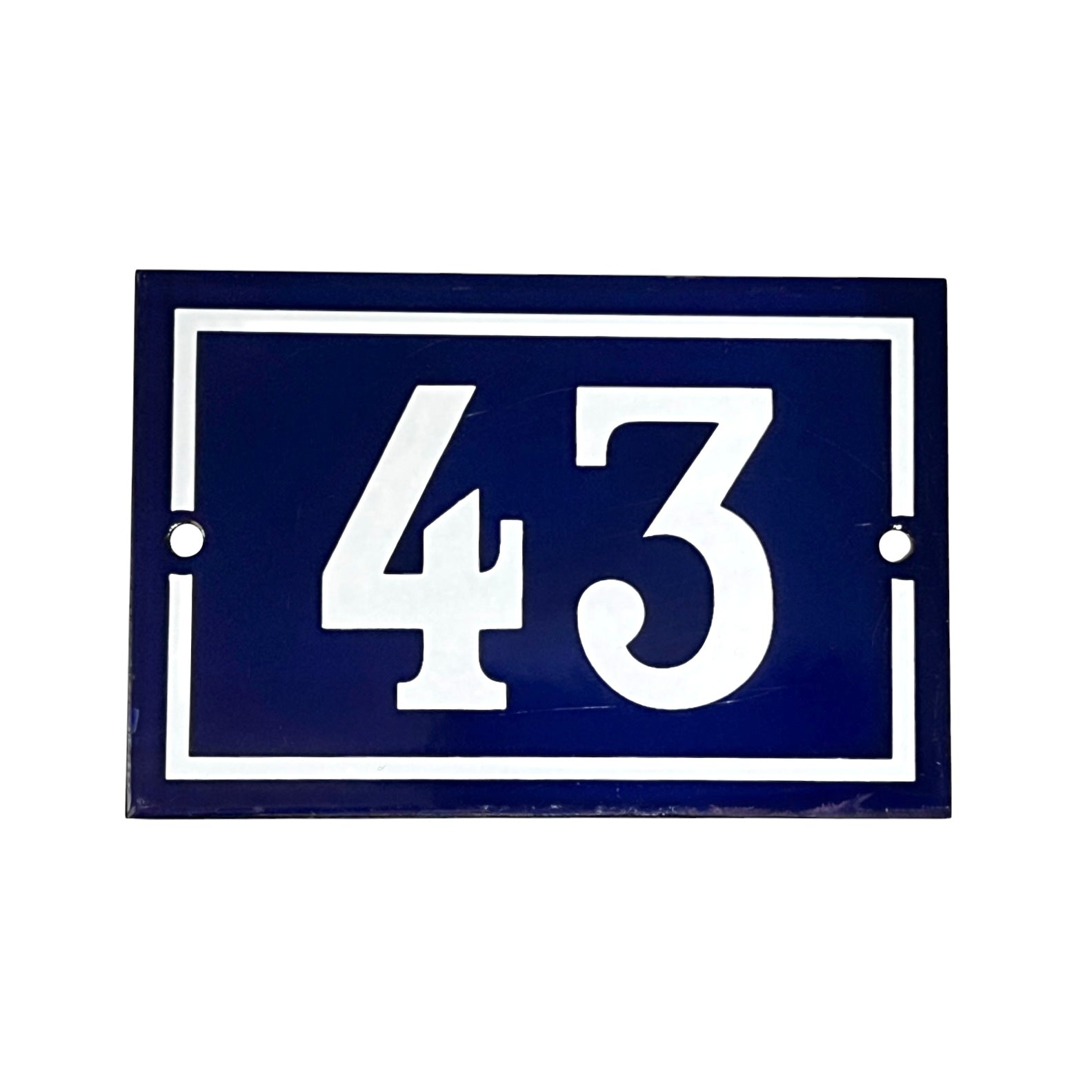 Navy blue plaque with white number '43' on a white background