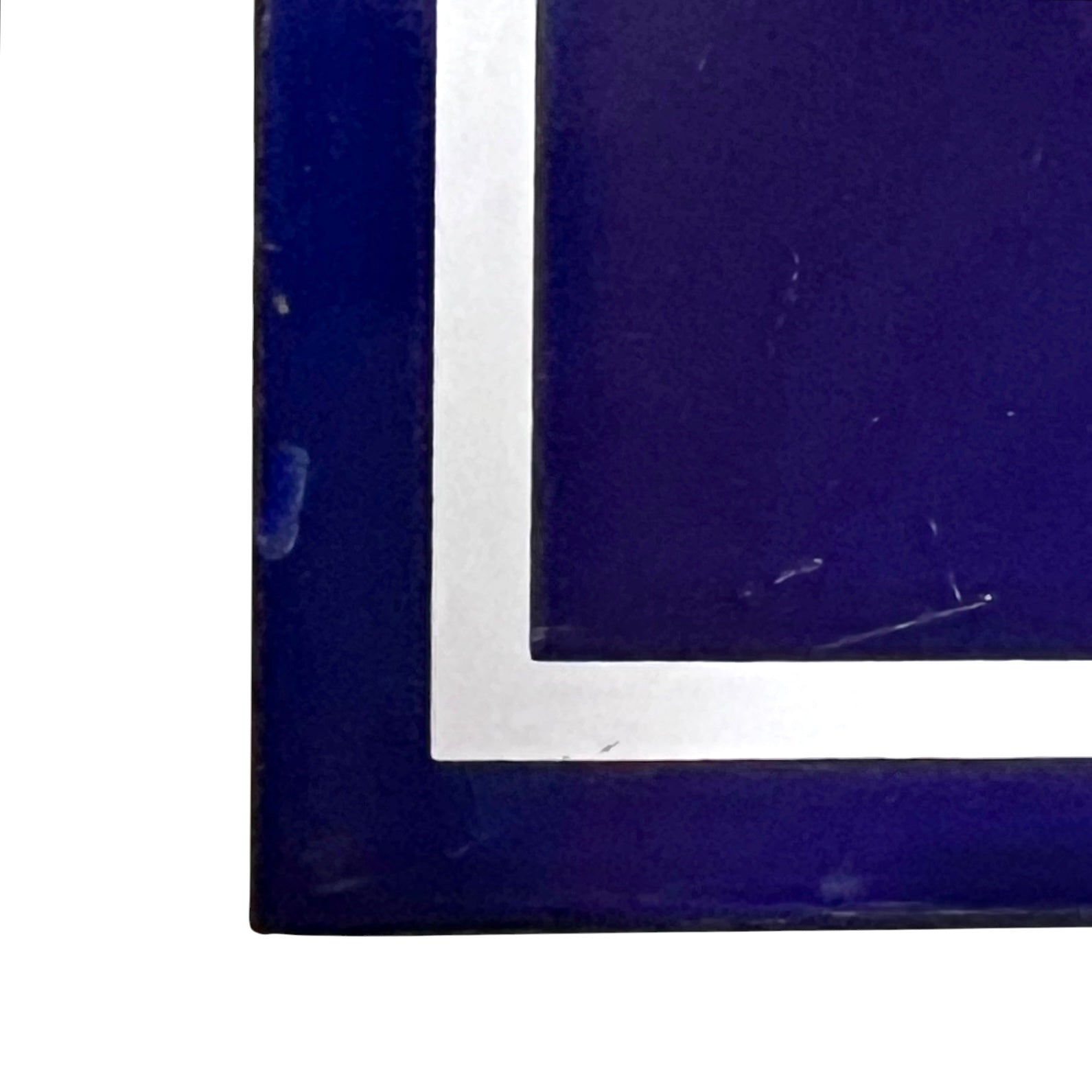 close up of a french blue door sign with white number '43' on a white background