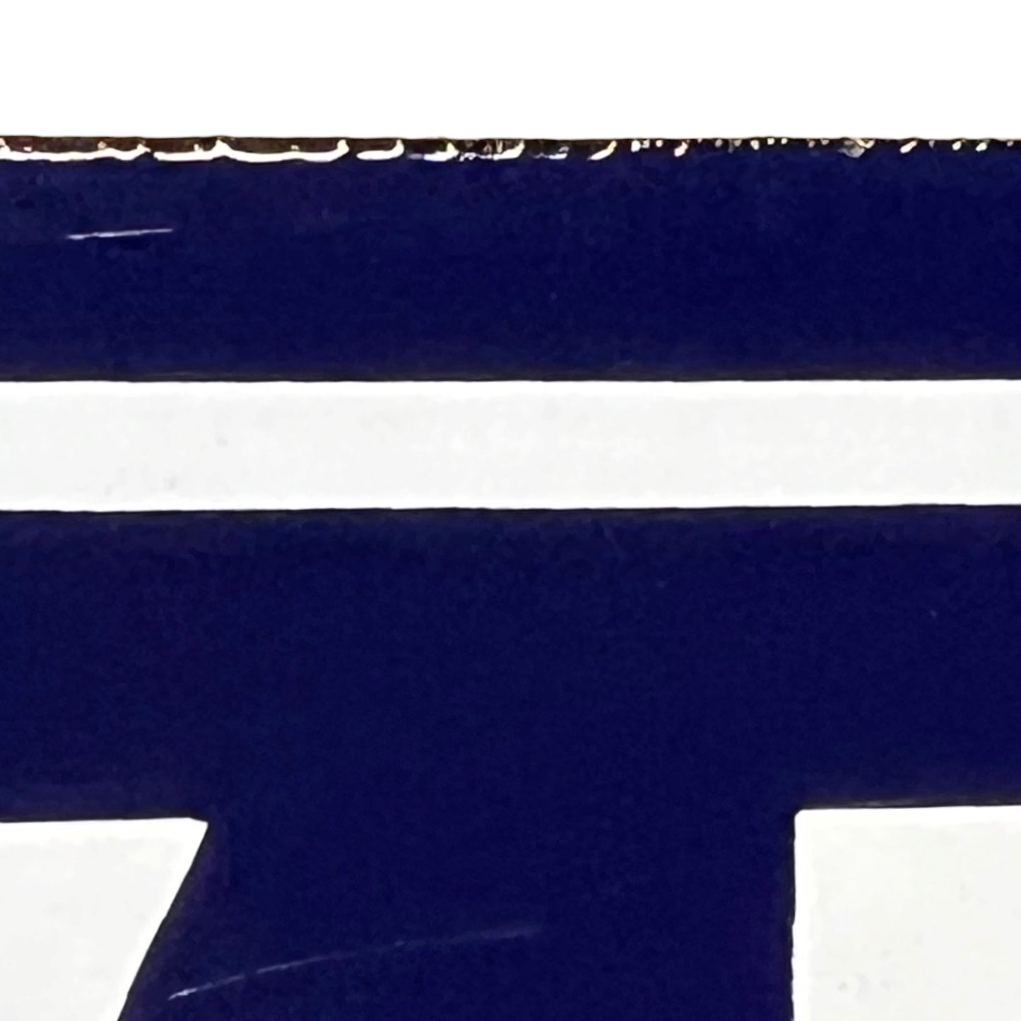 close up of a french blue door sign with white number '43' on a white background