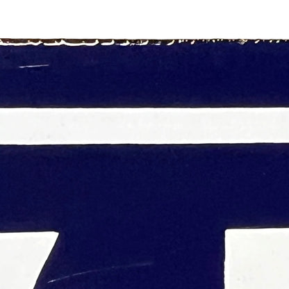 close up of a french blue door sign with white number '43' on a white background