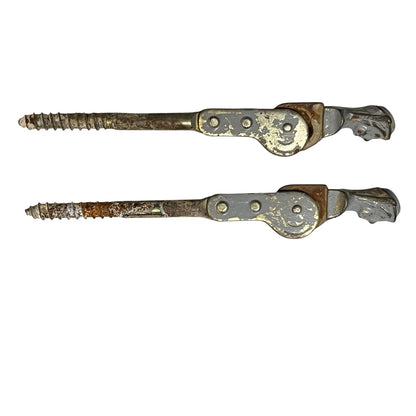 pair of metal Belgian ladies shutter dogs on a white background