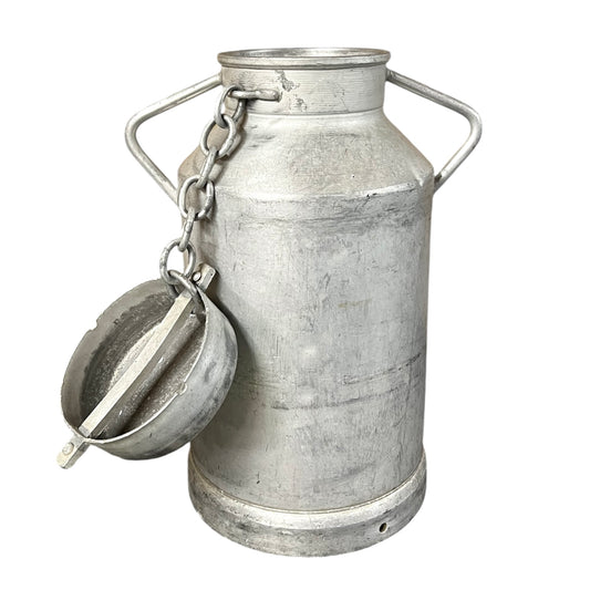 Vintage-style metal milk can with a lid on a white background