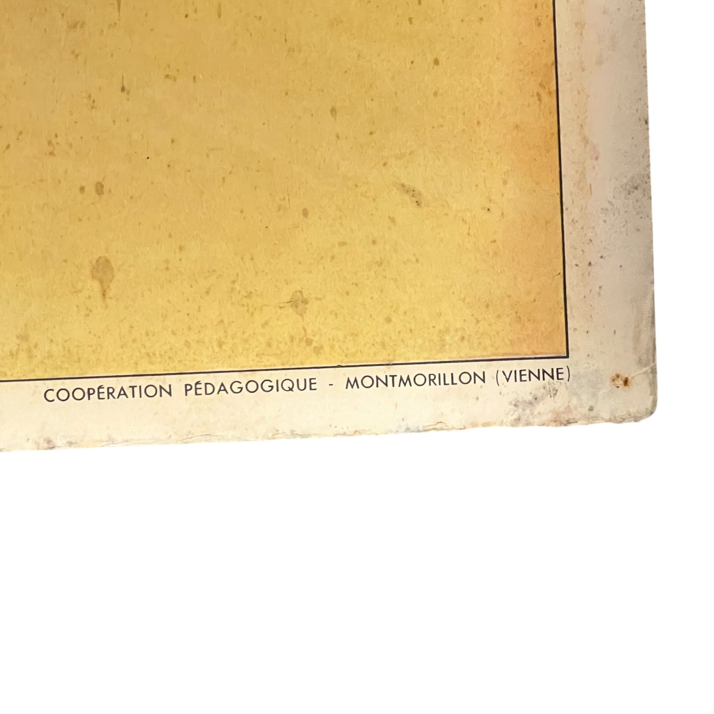 Corner of a book or paper with text on a white background