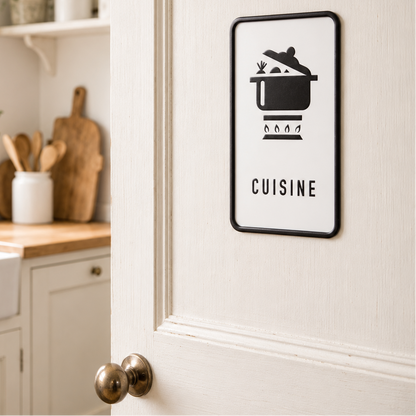 Kitchen door with a 'Cuisine' sign and cooking-themed design.