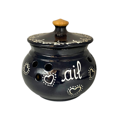 Blue ceramic pot with decorative hearts and the word 'ail' on a white background