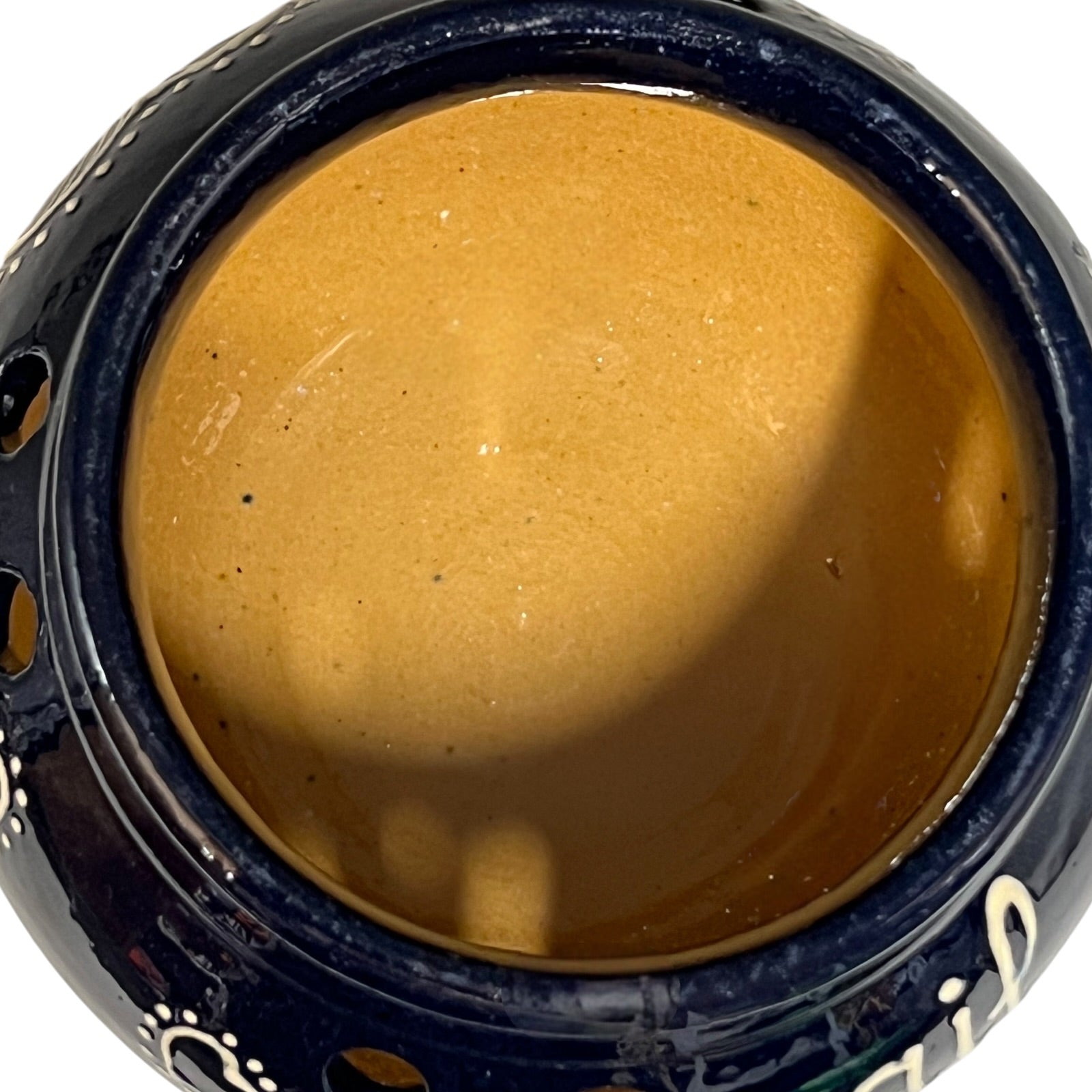 Close-up of a ceramic container brown  inside