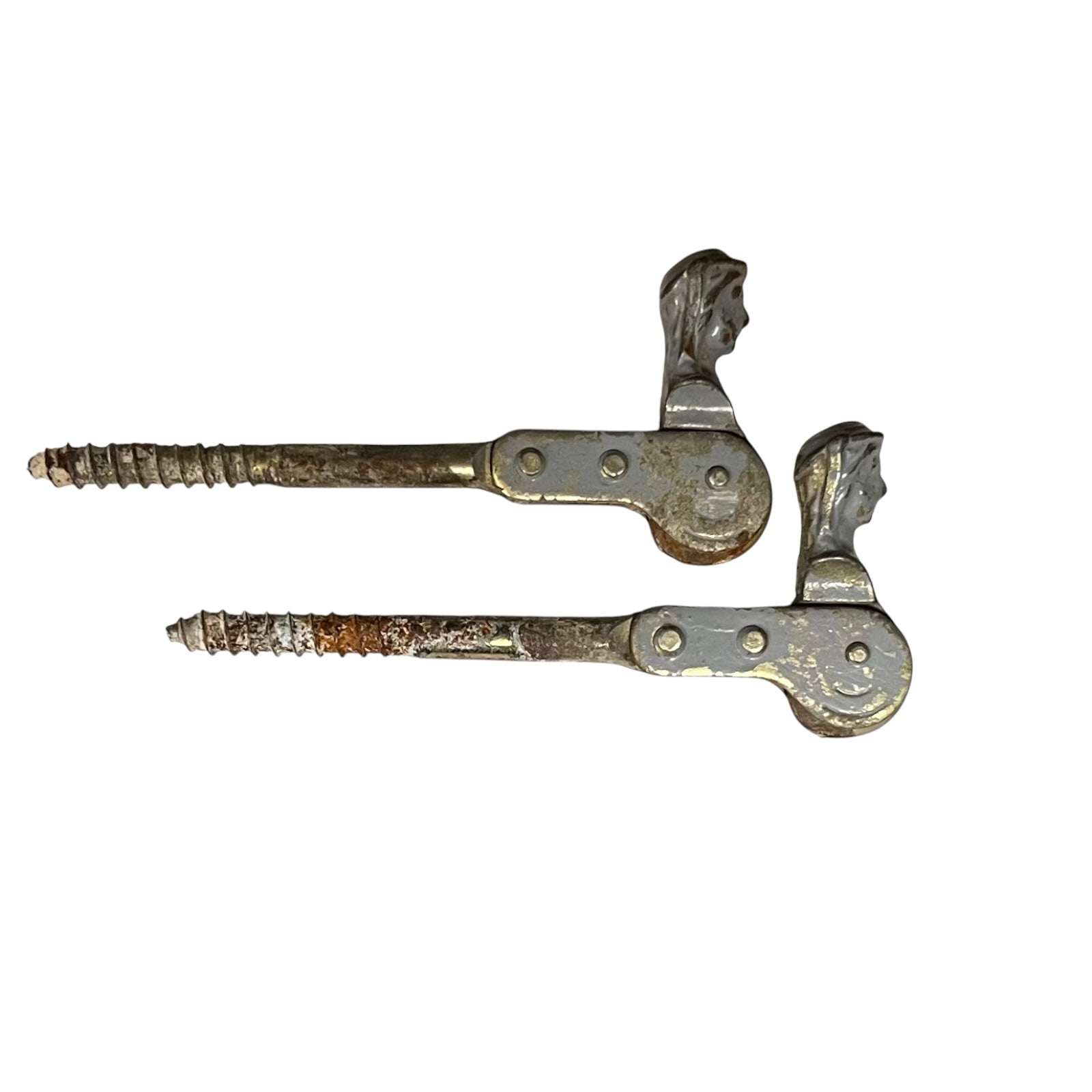 Two rusty metal Belgian ladies shutter dogs on a white background