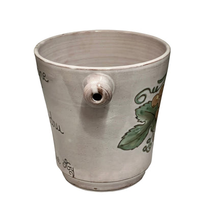 Ceramic ice bucket with decorative elements on a white background