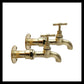 Pair of solid brass wall mounted kitchen or bathroom taps sold by All Things French Store