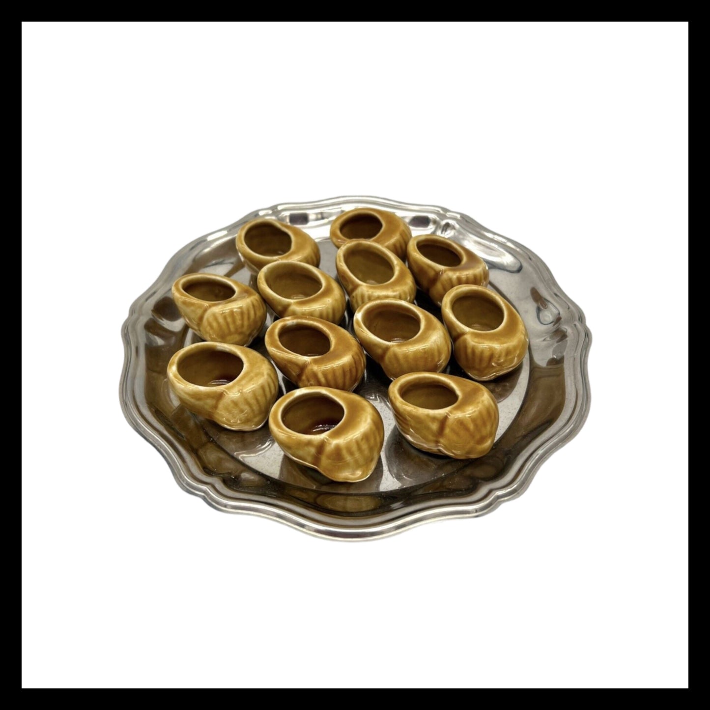 12 French glazed ceramic snail pots on a silver tray with a white background sold by All Things French Store