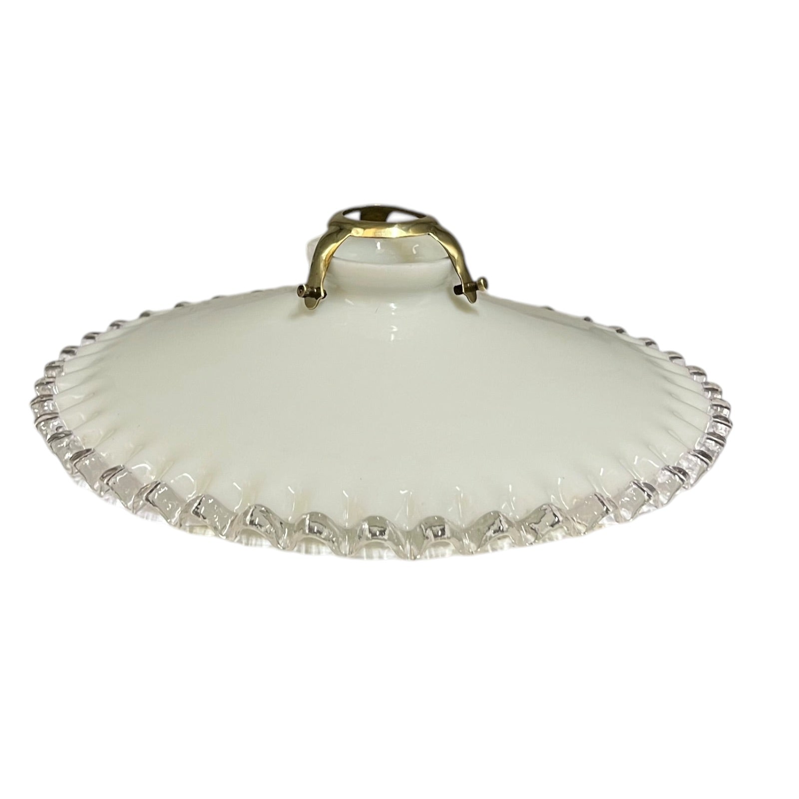 A vintage French milk glass pendant lampshade with a brass gallery holder shown on a white background 