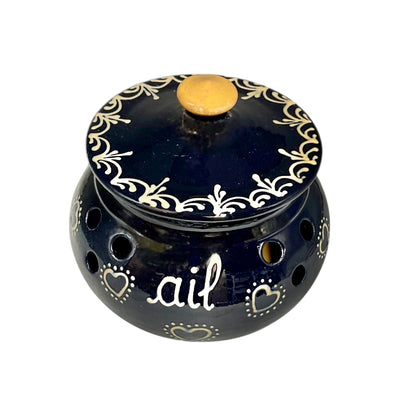 Decorative blue pot with white patterns and 'ail' text on a white background
