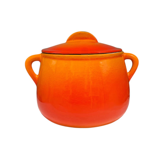 An orange ceramic lidded pot with two side handles, shown on a plain white background.