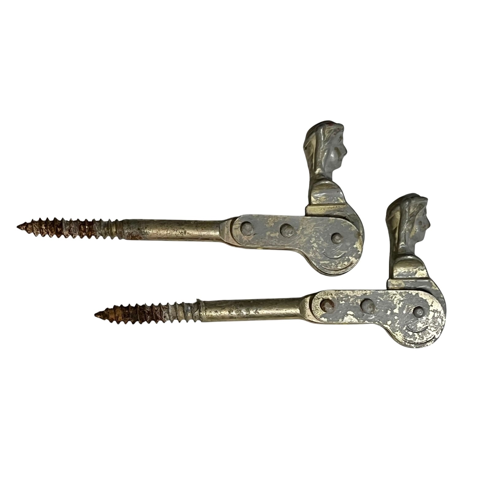 Two rusty metal Belgian ladies shutter dogs on a white background
