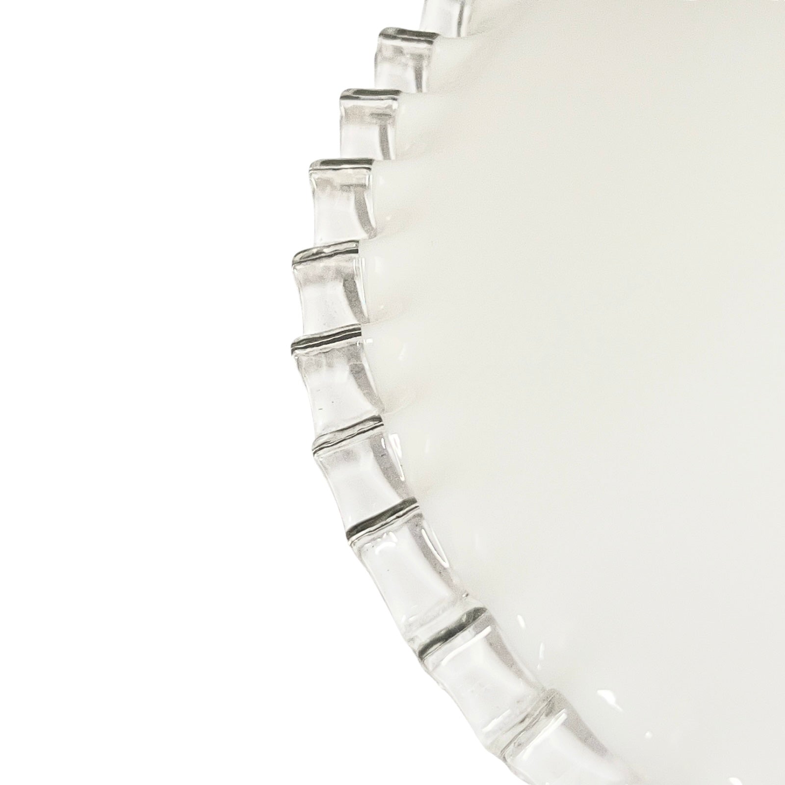 close up of clear rim on French vintage milk glass pendant lampshade on a white background 