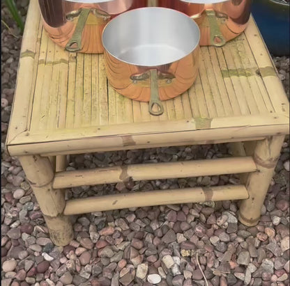 video of copper pan set taken in a garden