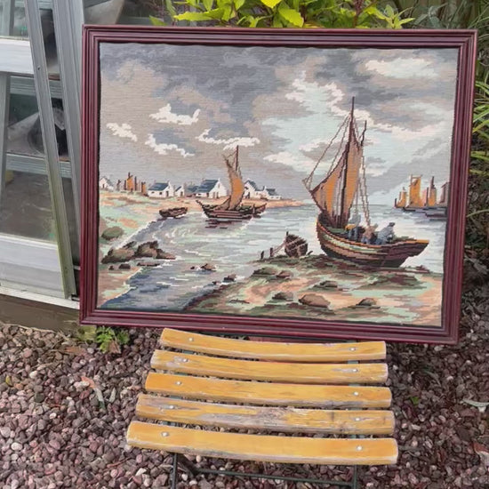 video of a framed needlepoint tapestry 