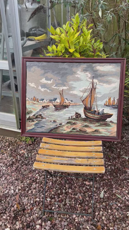video of a framed needlepoint tapestry 