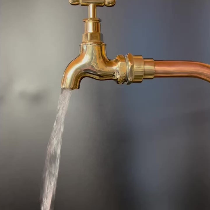 video of a small brass tap showing the water flow