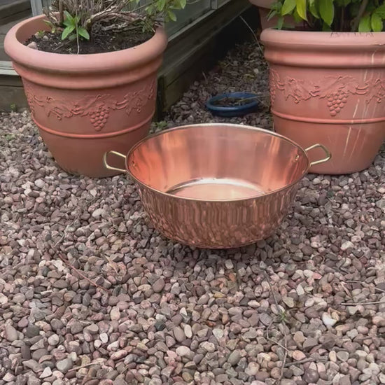 video of a copper up cycled sink basin in a garden setting 