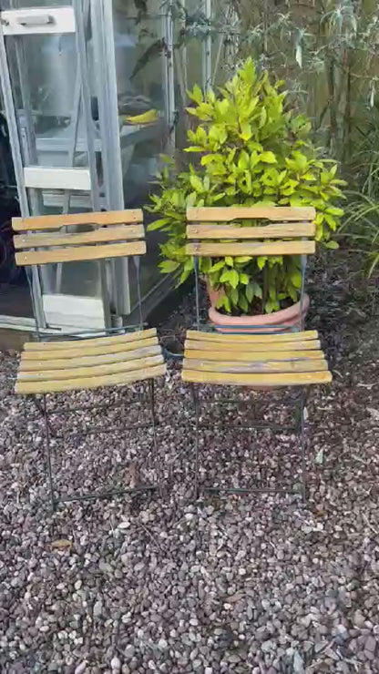 video of 2 French folding chairs 