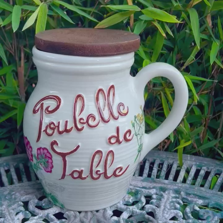 video of a French ceramic table bin in a garden setting