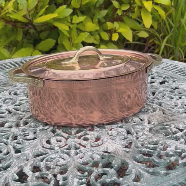 copper pot on a garden table 