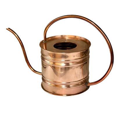 A polished copper watering can with a long spout, curved handle, and ribbed cylindrical body, shown on a plain white background.