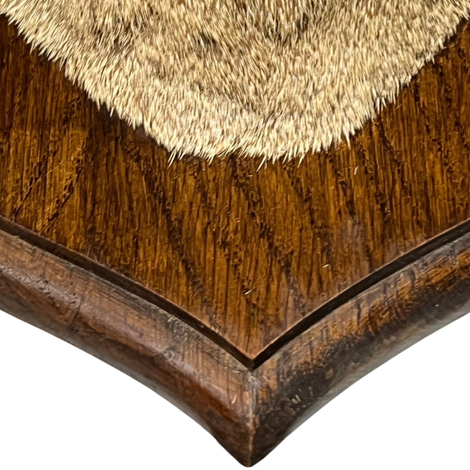 Close-up of a wooden surface with a textured brown finish