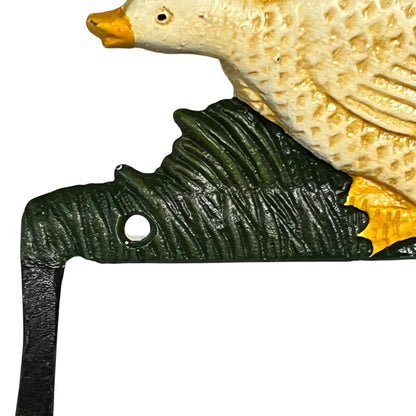 Decorative metal toilet paper holder shaped like a goose on a white background