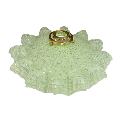 A light green textured glass shade with a flared, ruffled edge and a gold metal mounting ring at the top, shown against a plain white background.