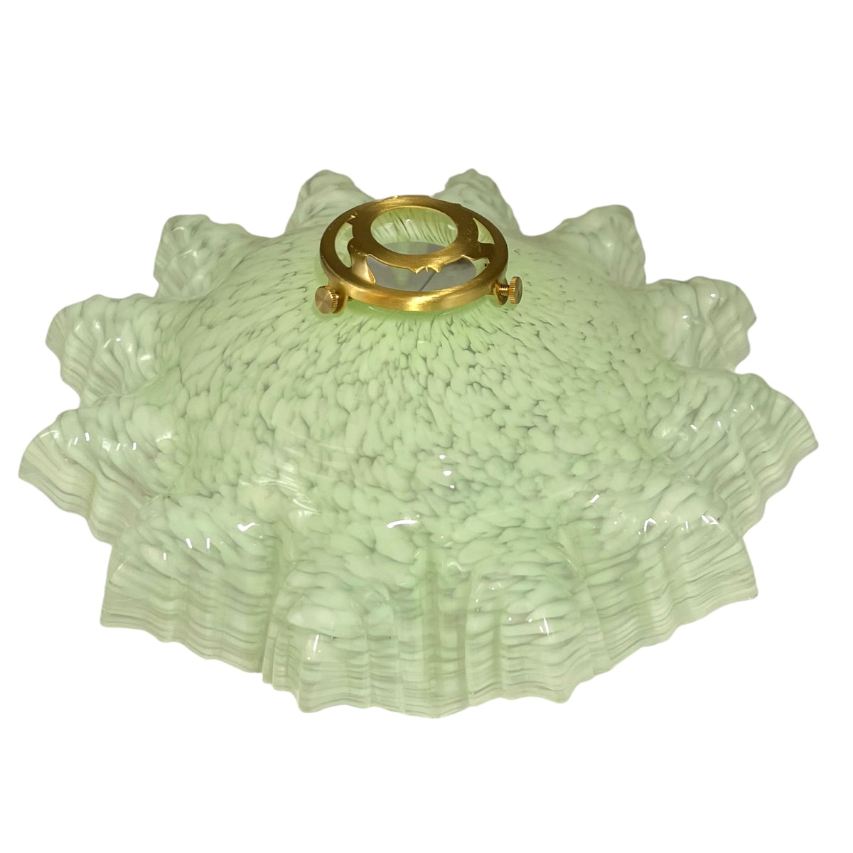 A vintage light fixture glass shade with a textured, ruffled design in pale mint green, featuring a central gold metal mount.