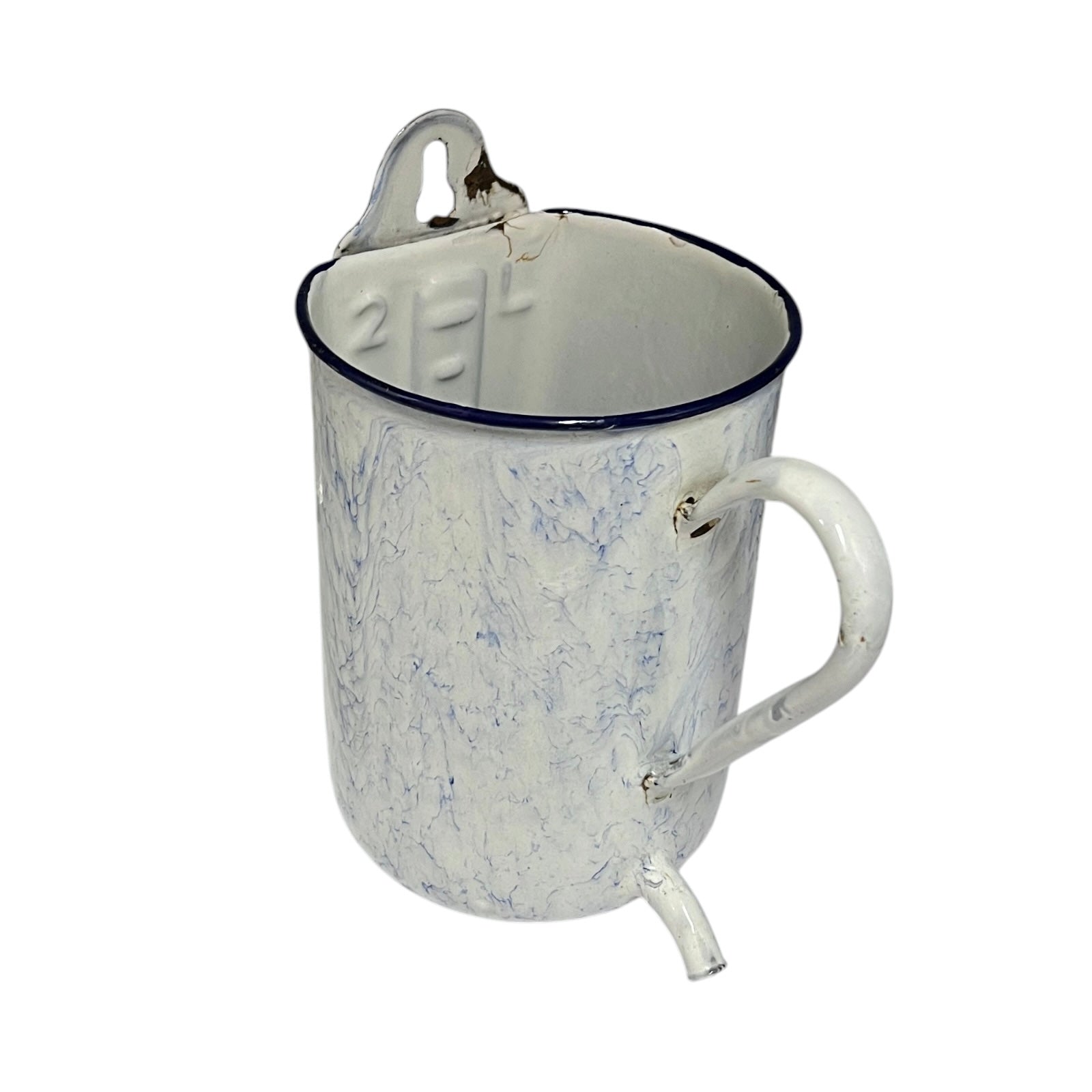 A vintage enamel pitcher with a white marbled finish, a dark blue rim, a metal pouring spout, and a carrying loop on a white background.