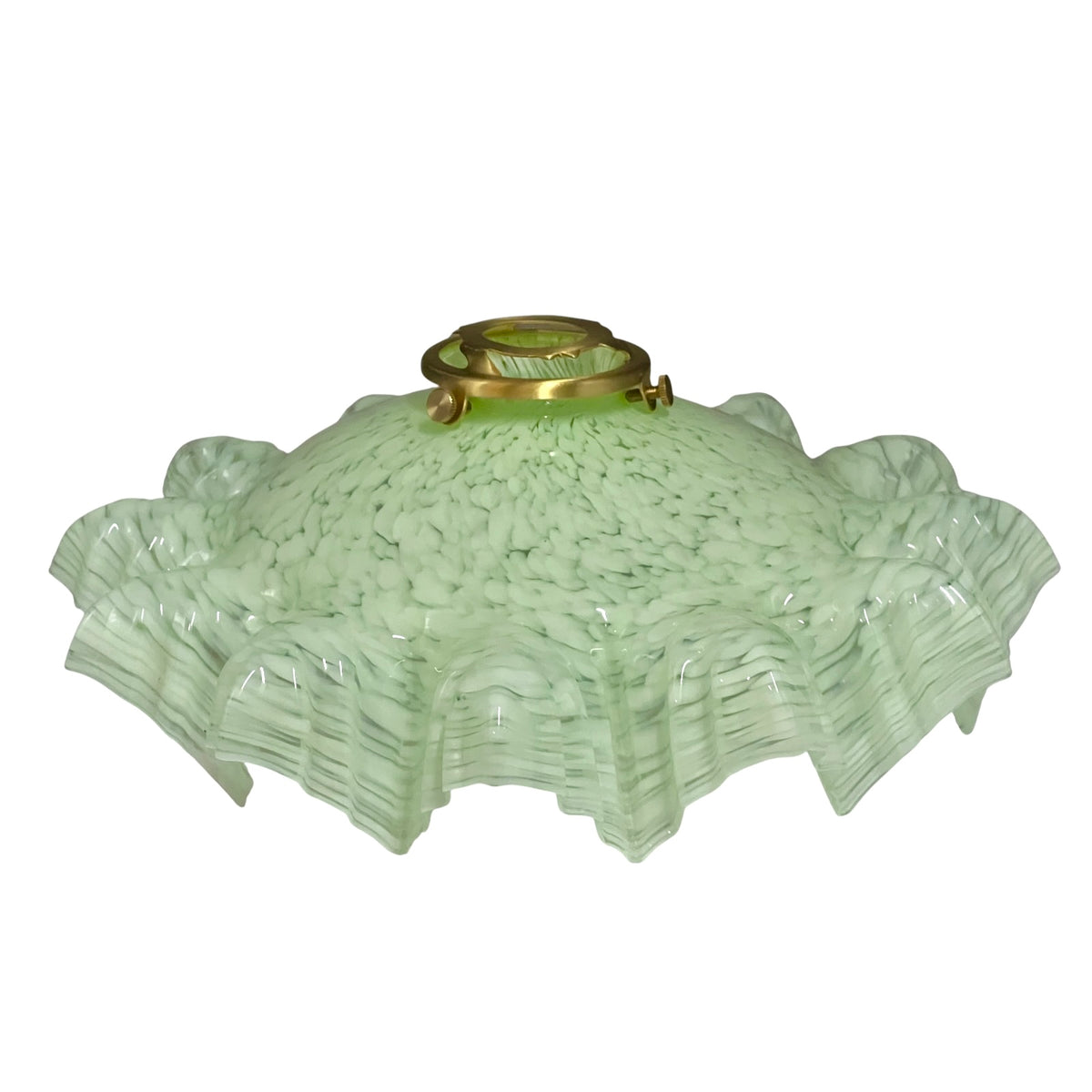 A vintage light green textured glass lamp shade with a flared, ruffled edge and a brass metal fixture at the top, shown against a plain white background.