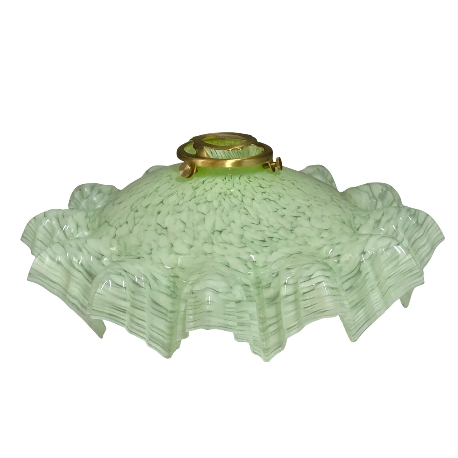 A vintage light green textured glass lamp shade with a flared, ruffled edge and a brass metal fixture at the top, shown against a plain white background.