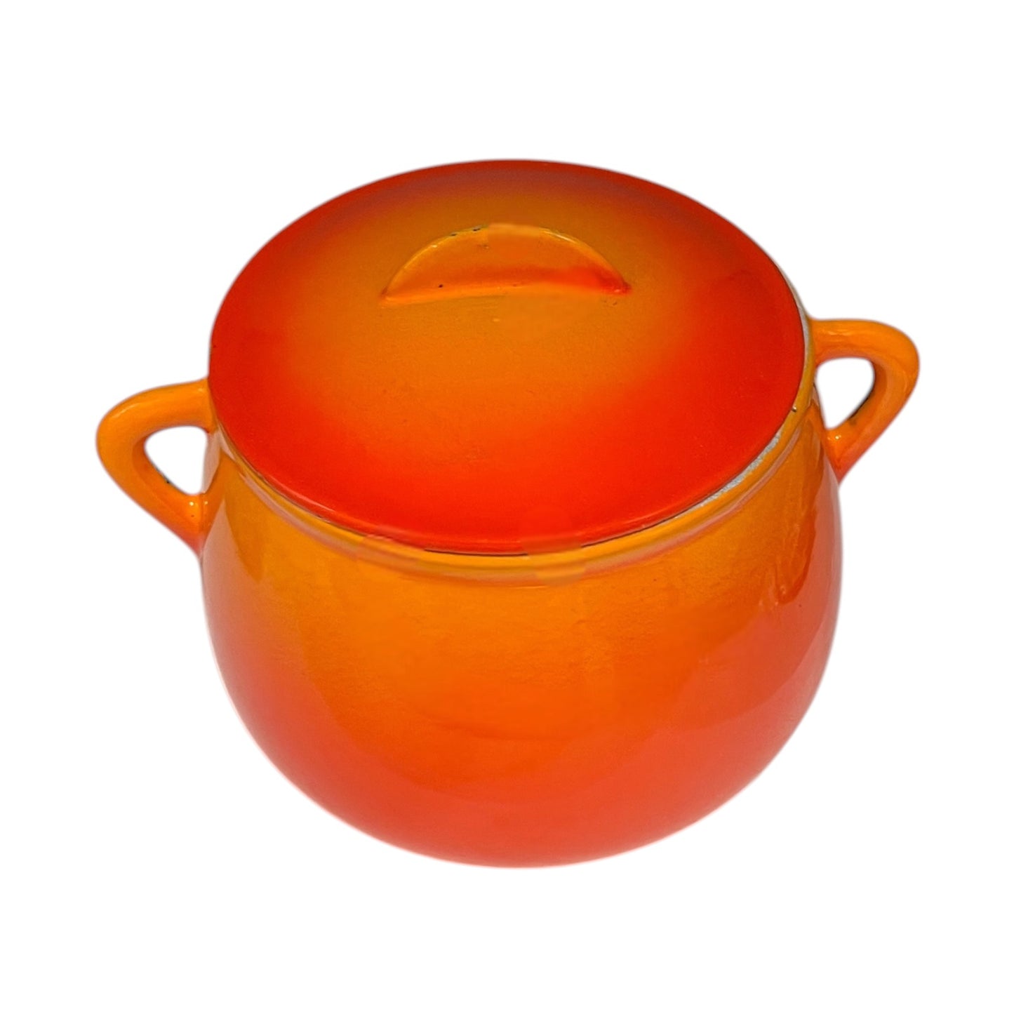 An orange vintage Le Creuset bean pot with two side handles, shown on a plain white background.