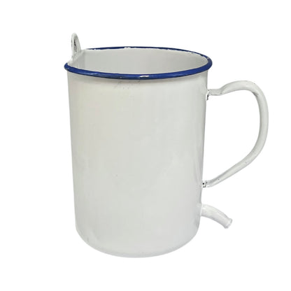 A white enamel mug with a blue rim, featuring a built-in metal spoon on the left side and a small metal loop on the handle, set against a plain white background.
